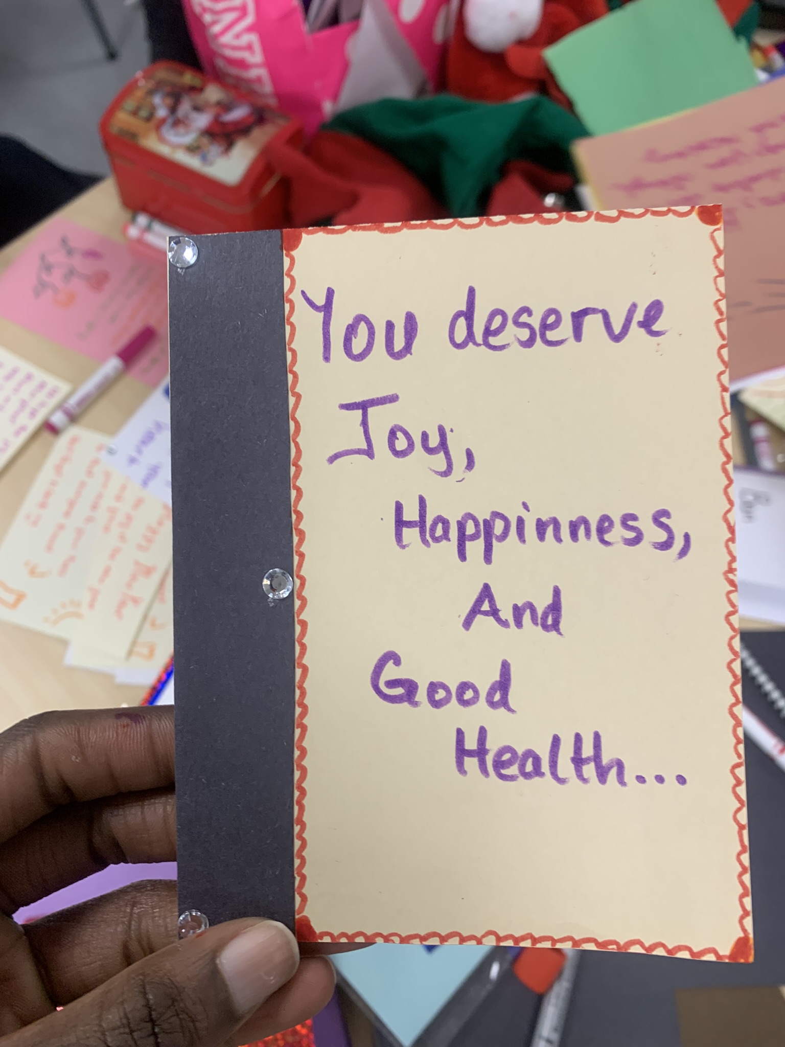 Card with dark border and purple text reading 'You deserve Joy, Happiness, And Good Health...'