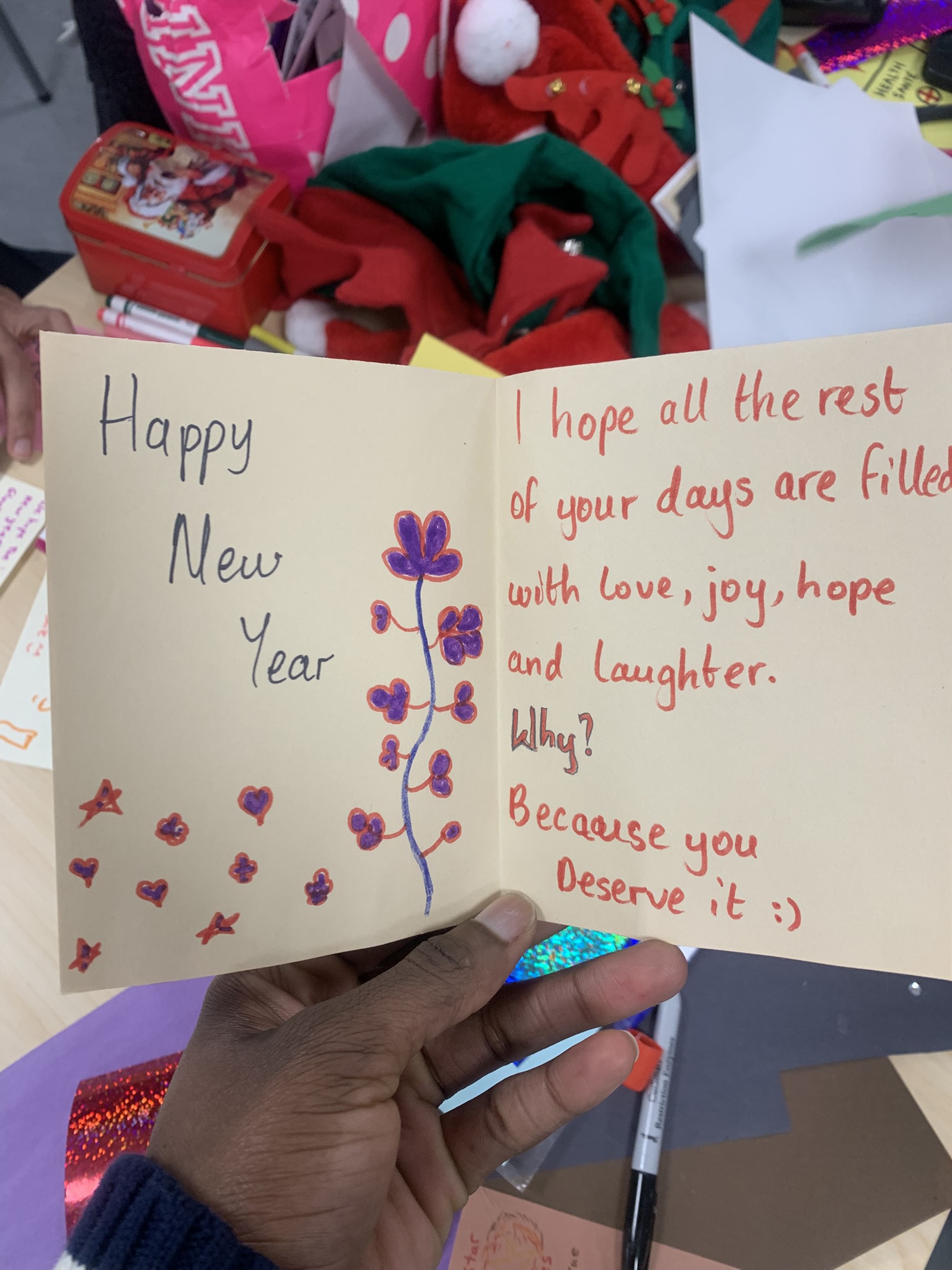 Card with green and pink decorative elements reading 'Bonne Année'